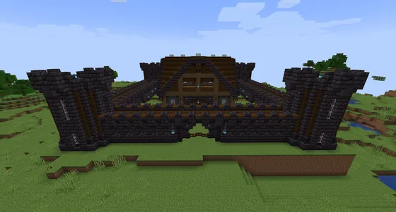 Dark Medieval Castle with Central House Minecraft schematic